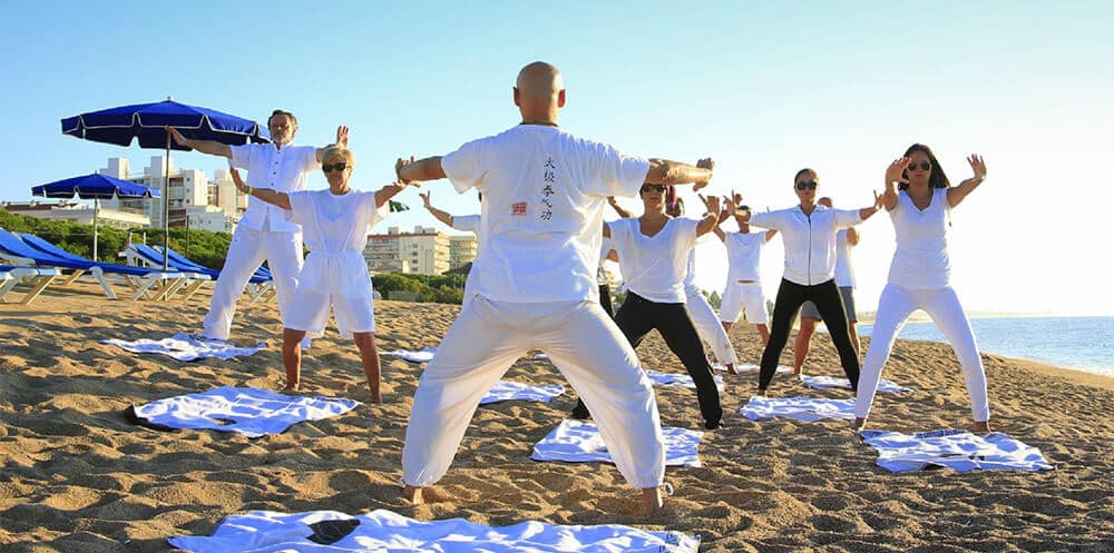 group of people do taichi exercise
